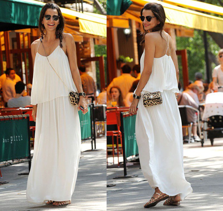 巴西名模 Fernanda Motta 一身希臘女神般的白色洋裝，搭配豹紋肩背小包在優雅氣質中點綴一絲野性。金色平底涼鞋也很搶眼。圖／達志影像