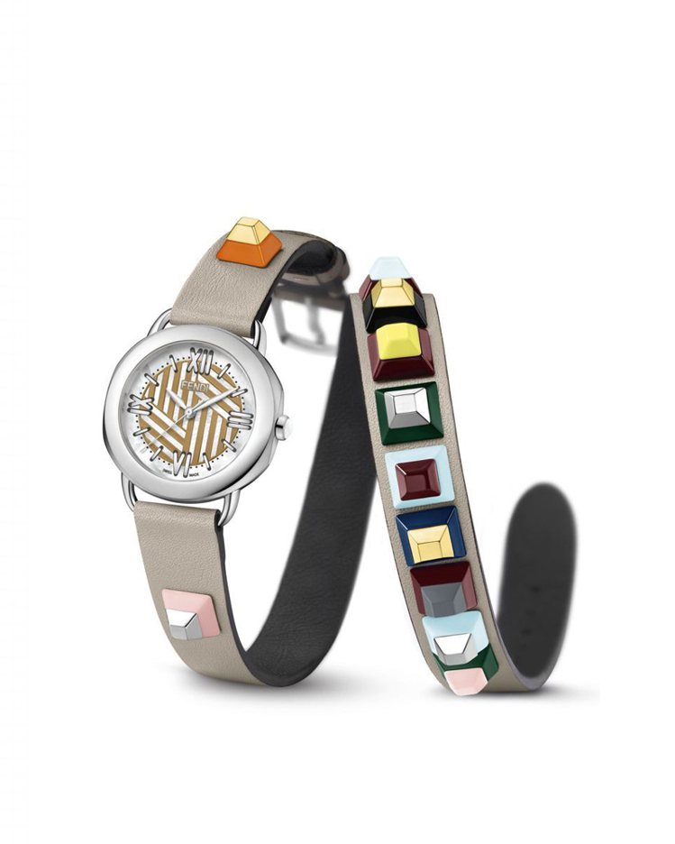 Fendi 的 Selleria Strap You系列腕表，36毫米不鏽鋼表殼、石英機芯，錶盤鑲嵌白色珍珠母貝，搭配可換式雙圈Fendi Dolce小牛皮配彩色Lucite鉚釘。腕表44,500元，表帶另售15,000元。圖／葳鑠提供