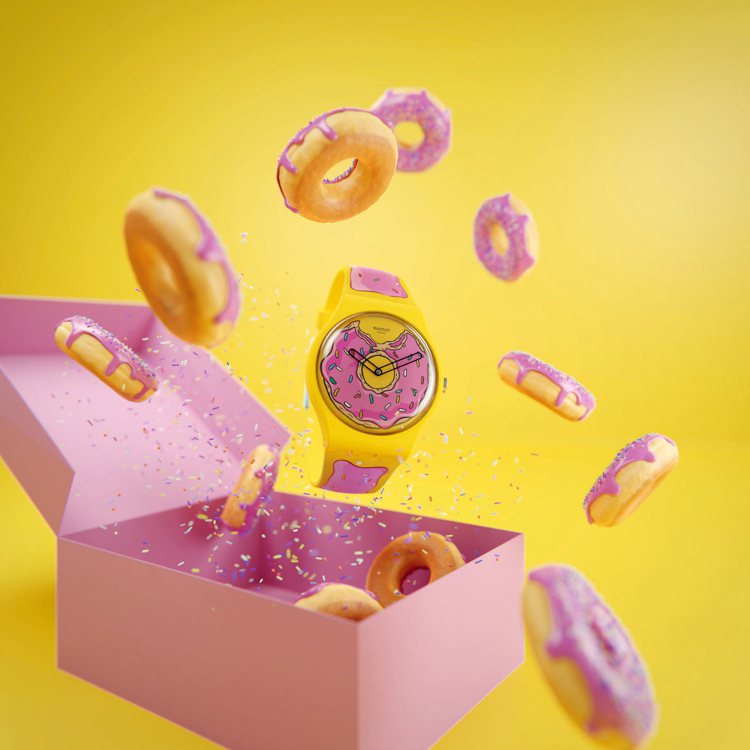 粉紅巧克力醬甜甜圈已成為荷馬辛普森的象徵，於是Swatch全新Seconds Of Sweetness腕表，便以被咬了一大口的甜甜圈點綴彩色糖粒圖案當作表盤主題。圖／Swatch提供