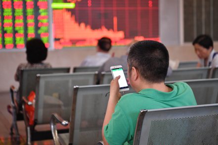 外國投資者正在躡手躡腳地重返中國大陸內地股票。 中新社