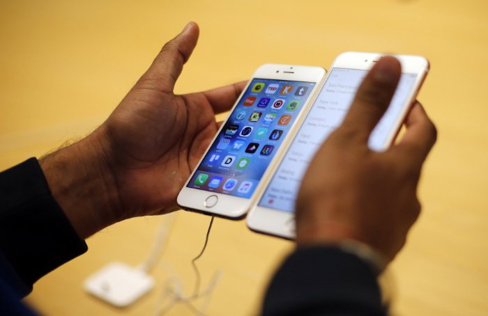 研究結果發現，使用蘋果系統的手機用戶更加看重自己所使用的手機品牌象徵。圖為蘋果i...