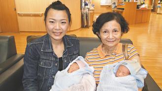 33歲的林巧薇（左）與姨媽分別抱著雙胞試管嬰兒，喜悅之情、溢於言表。 記者范振和...
