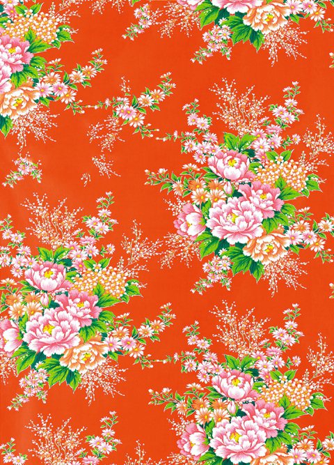傳統花布中的標準款，大紅色為基底搭配大牡丹四季花叢連續圖案。記者陳俊吉／攝影