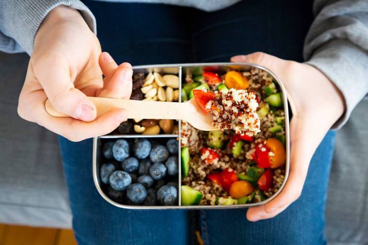Lunchbox with quinoa salad with tomato a...