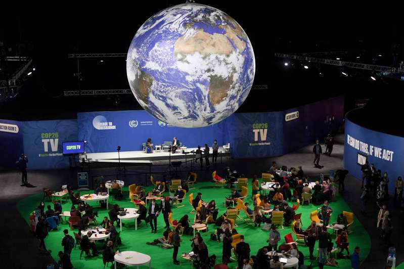 英國格拉斯哥氣候峰會主辦單位在會場設立「行動中心區」，與會者可在此舉辦討論會、發表會等各種活動。對於美中達成的加強氣候行動宣言，專家們十一日都表示審慎歡迎。（法新社）