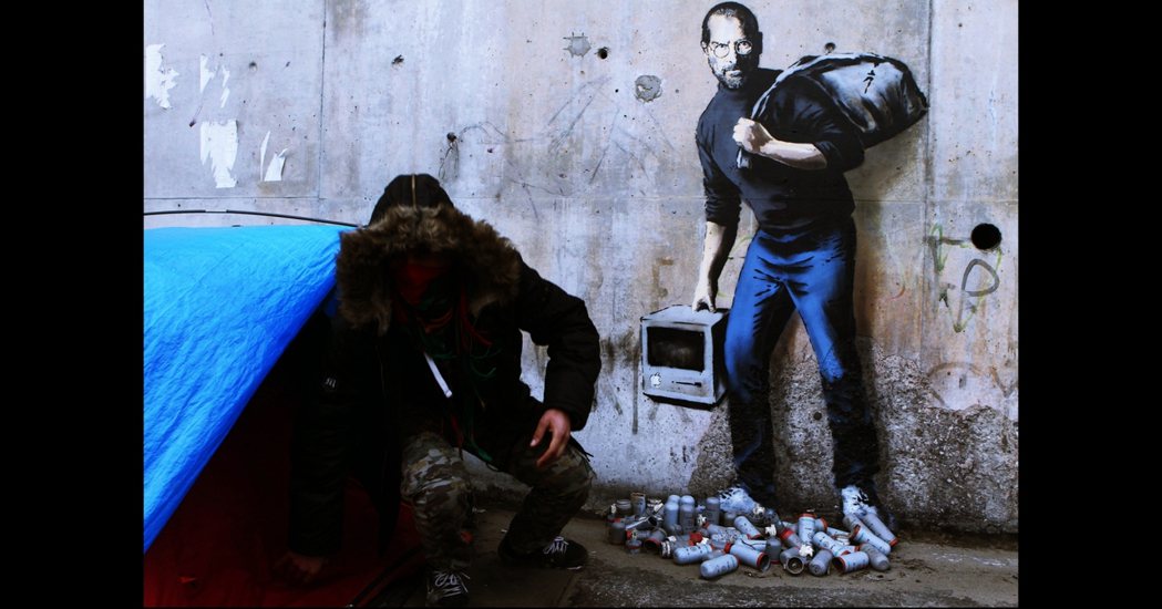 圖為Banksy針對移民所做的塗鴉，指賈伯斯的生父也是敘利亞裔移民，如果當初沒有...