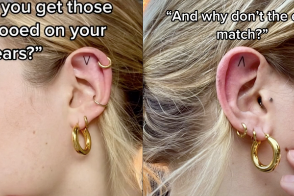 影片中女子展現自己耳朵兩邊方向相反的箭頭刺青。圖/@garbage.bird