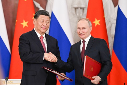 中國大陸國家領導人習近平（左）與俄羅斯總統普亭（右）。新華社