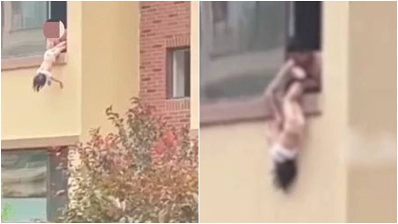 影片片段顯示，該名父親拎著女兒的腳脖倒掛其於窗外訓斥，期間女童大聲哭嚎，明顯受驚，場面令人心酸。（影片截圖）