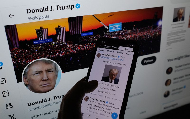 美国前总统川普24日在前称推特的「X」平台张贴监狱照，是继2021年1月后首度在该平台推文。法新社(photo:UDN)