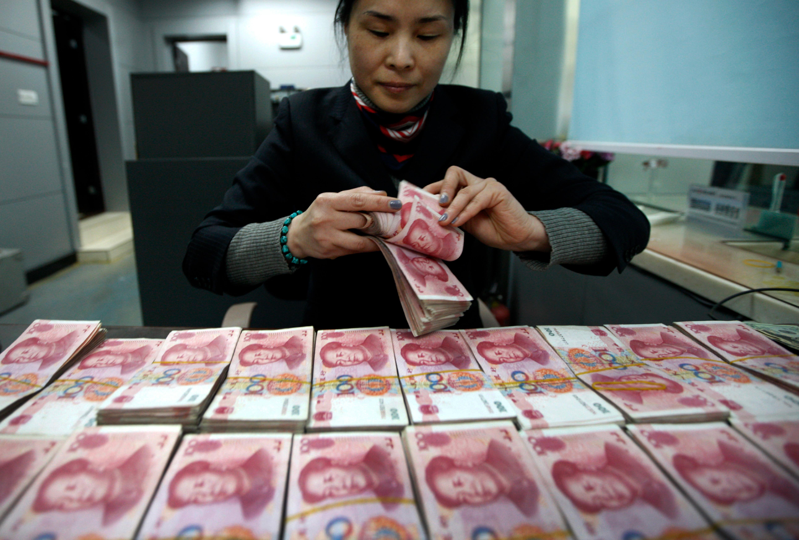 中國人民銀行國際司司長金中夏稱，「今年以來，人民幣國際化取得了新的可喜進展」。（美聯社）