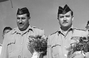 1957年9月6日，約旦政府代表阿曼警備司令瓦茲‧馬賀准將（左）和約旦軍總部參謀沙利姆中校（右）抵台訪問。圖／聯合報系資料照片