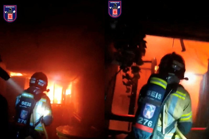 西班牙東南部穆西亞市市長巴列斯塔表示，當地一家夜店今天早上發生火災，至少造成7人死亡，救援人員仍在尋找災後下落不明的民眾。圖為消防隊員在西班牙穆爾西亞一家夜總會中，努力控制火焰。路透