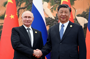 俄羅斯總統普亭（左）與中國大陸國家主席習近平（右）的互動，將牽引著國際局勢變化。路透